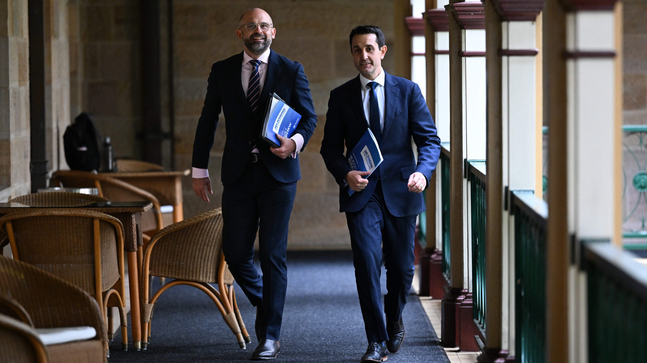 Queensland Premier David Crisafulli (right) and Treasurer David Janetzki arrive to address the media at the state budget media lockup at Parliament House in Brisbane. Mr Janetzki will deliver his first state budget today.