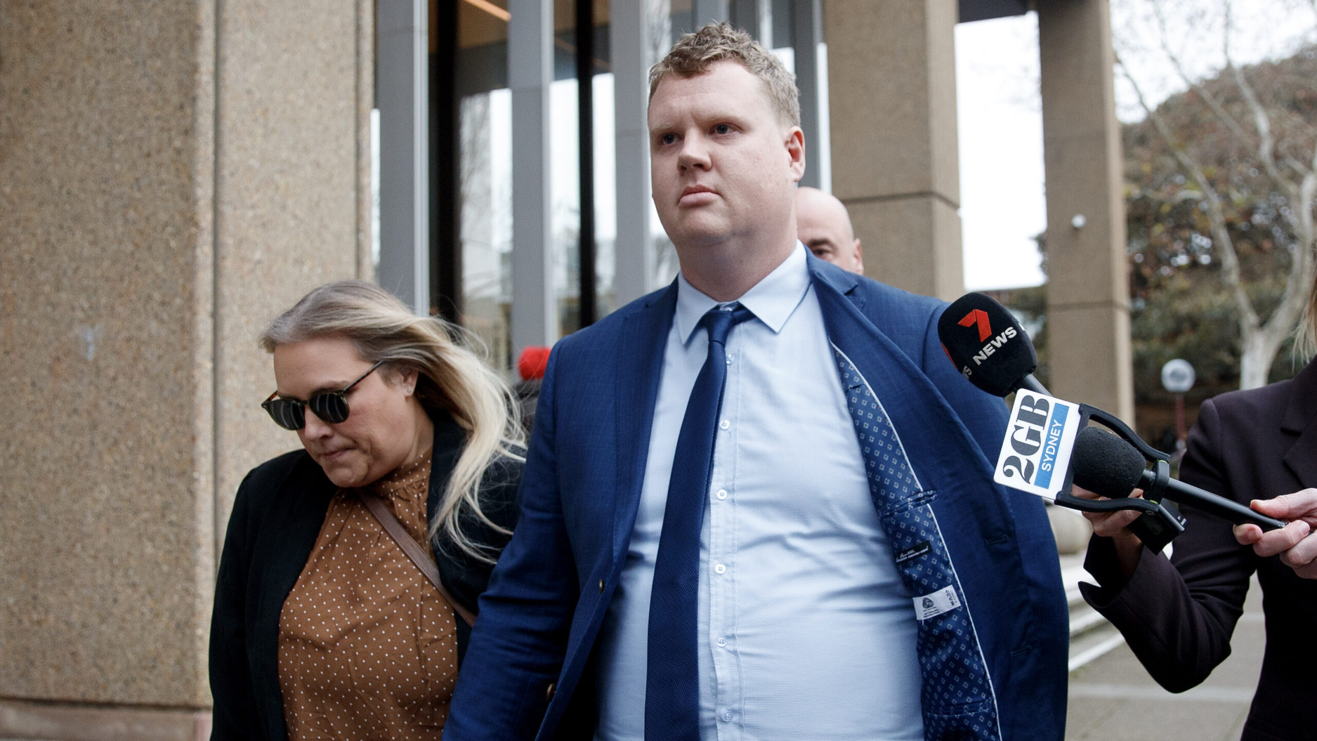 Kristian White leaves the Supreme Court alongside his wife.