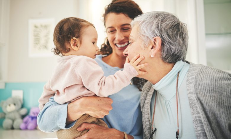 Grandmother, mother and baby in home for playing, quality time and bonding together in living room. Love, happy family and mom carrying child with grandma play for loving, affection and happiness