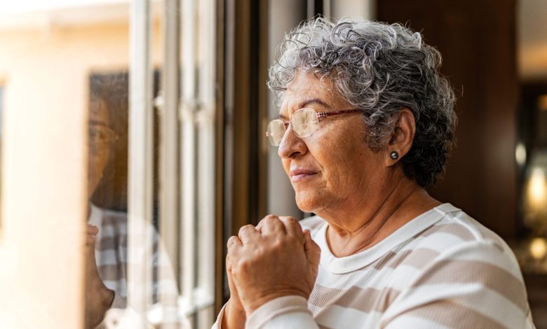 Senior woman contemplating at home